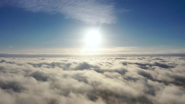 Flight through the moving cloudscape. Texture of clouds. Airplane view