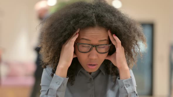 Portrait of African Businesswoman Having Headache