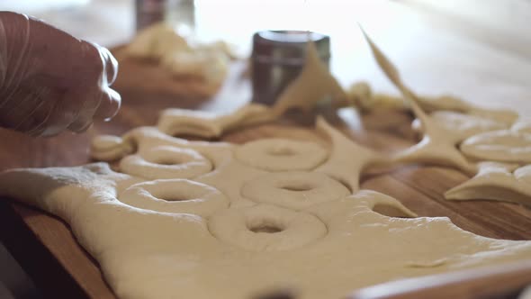 The Master Is Shaping the Pastry Into Donuts