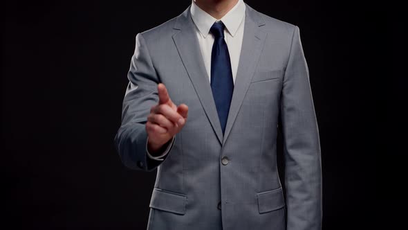 Studio portrait of successful and smart businessman in suit and tie.