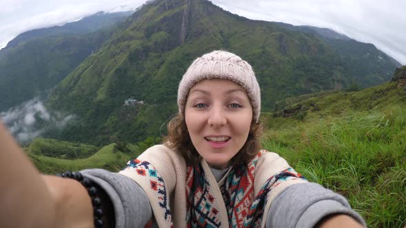 Young Woman Traveler Taking Selfie At Mountain Top