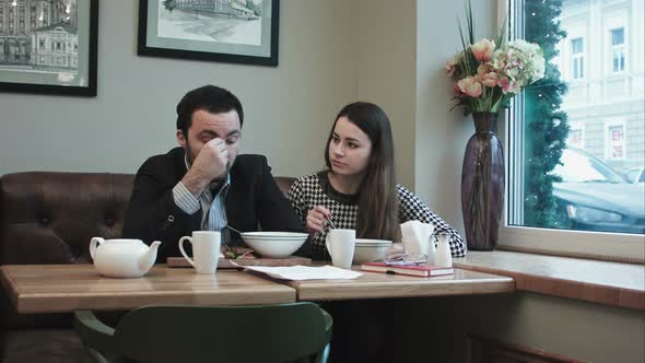 Business Woman Cheer Tired Colleague at Lunch