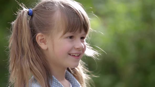 Close Up Portrait of a Pretty Smiling Little Girl