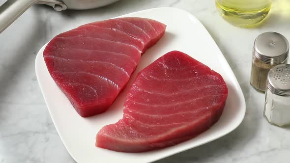 Plate with fresh raw slices of tuna fish