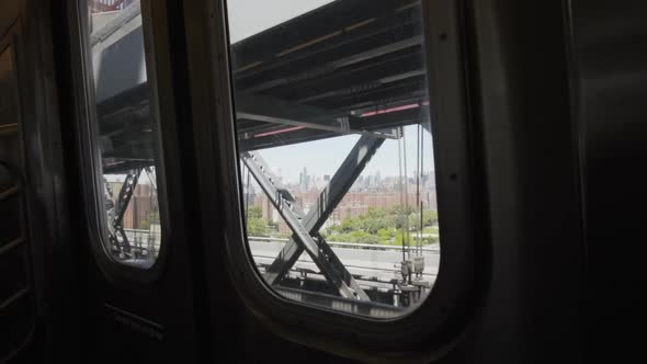 View of New York City Buildings From the Window of NYC Subway Train