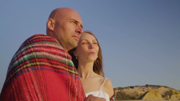 Happy Couple in Love Looking Away on Beach