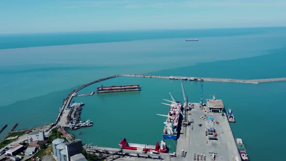 Aerial top view of cargo ship standing in the port