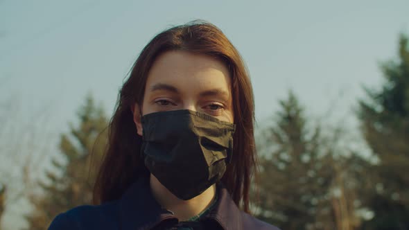 Woman Removing Virus Mask Breath for Fresh Air