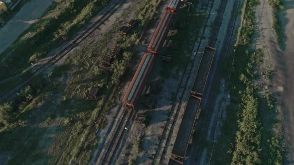 Aerial Of A Freight Train Passing Through Mexican northern Countryside