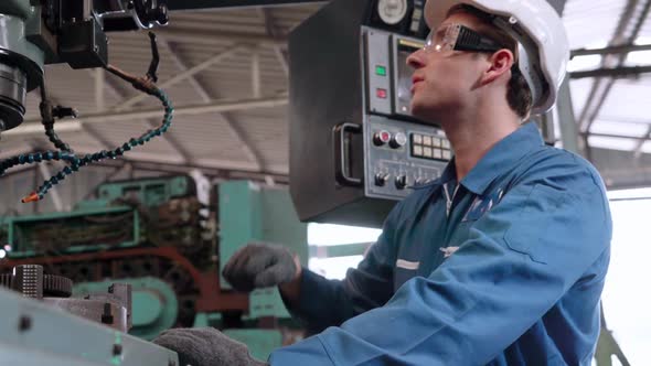 Smart Factory Worker Using Machine in Factory Workshop