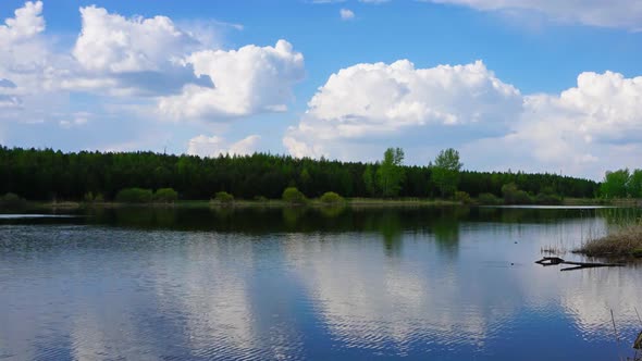 Clouds in Smooth Water of Lake, Panorama Timelapse