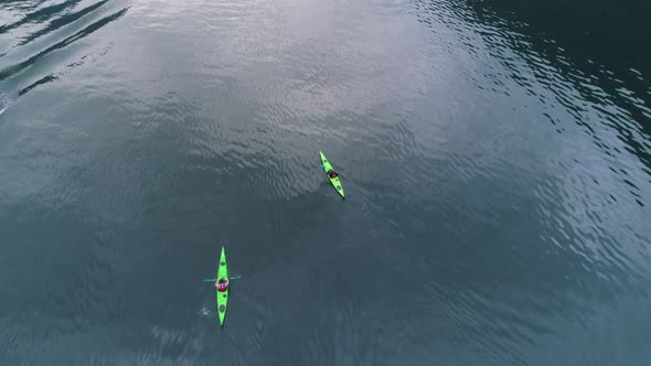 Two Green Kayaks in Turquoise Water of the Fjord. Norway. Aerial View