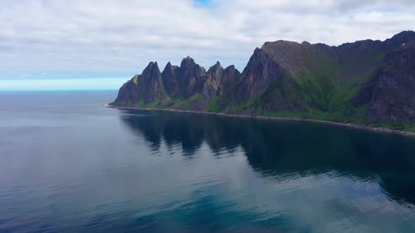 Popular travel destination and Rock Davil’s Jaw in the sunny summer day, Norway,island Senja