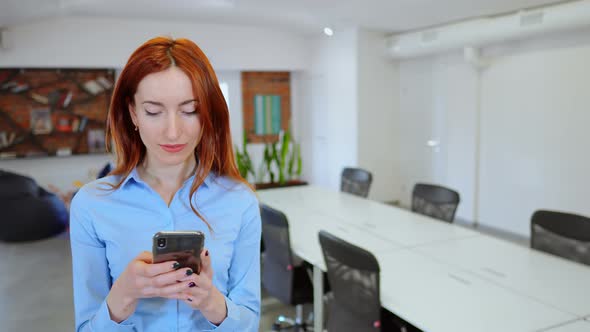 Employer Using App on Smartphone at Meeting Room