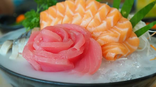Japanese sashimi set (salmon, tuna) with dry ice smoke.