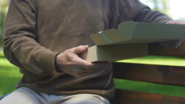 Old Man Opening Carton Box and Looking Photo, Past Memories, Nostalgia, Archive