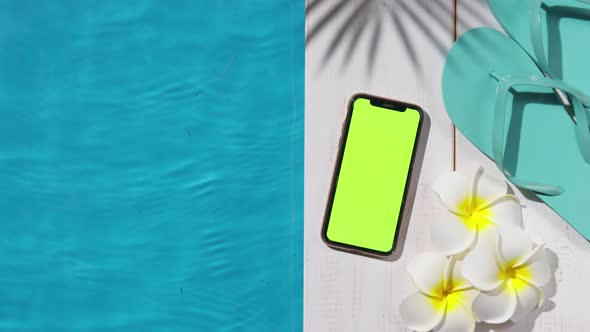 Flip Flops Flowers and a Phone By the Pool