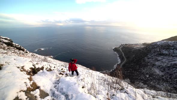 Hiker On Snowy Mountain Climb