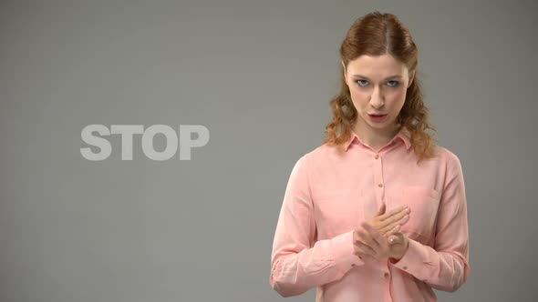 Woman Saying Stop in Sign Language, Text on Background, Communication for Deaf