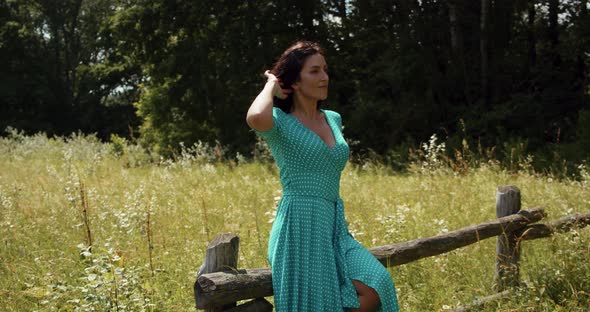 Girl In Nature Posing For A Photographer