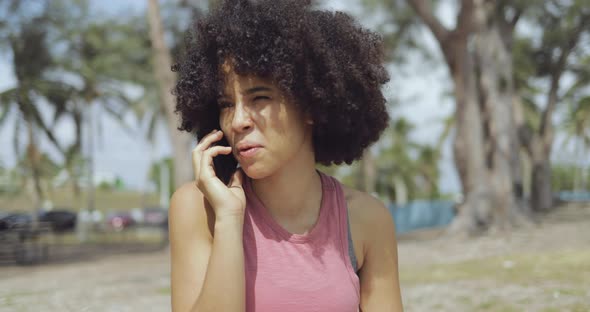 Content Ethnic Woman Speaking on Phone