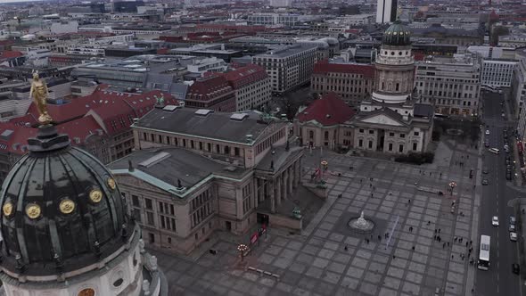 Forwards Fly Above Large Square with Historical Buildings