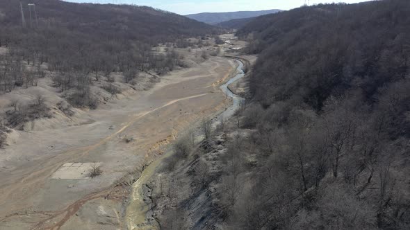 Polluted river stream and coastal area 4K aerial video