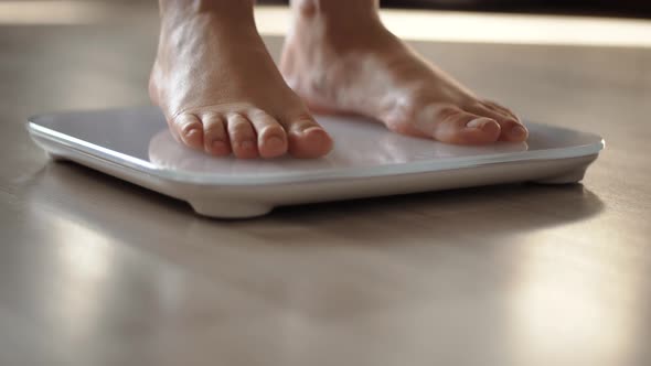 Girl Measuring Weight On Health Scale Weight.Woman On Scale.Scale Weight On Floor.Weighing Scales