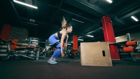 One Woman Does Crossfit Workout, Jumping on a Box.