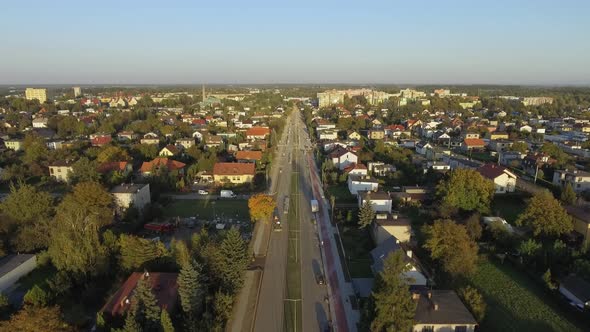 Aerial shot of a road under construction in small european town during sunset