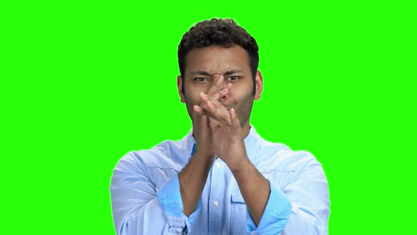 Young Man Making Funny Face on Green Screen