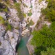 Flight Over a Mountain River and a Trail to a Gorge Among a Coniferous Forest - VideoHive Item for Sale