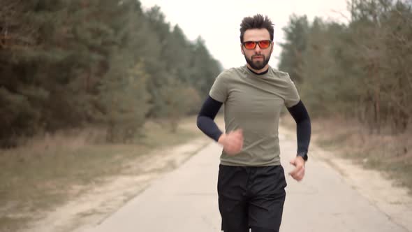 Sport Healthy Lifestyle. Runner Prepares For Marathon Hard Training Before Running Competition.