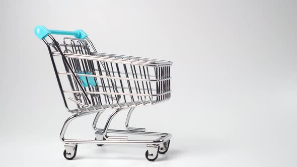 Shopping cart close up with a blue handle 