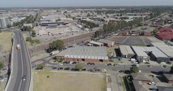 Aerial perspective of Dandenong infrastructure connecting city area to suburbs while truck pulls up