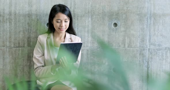 Business woman working on tablet computer 