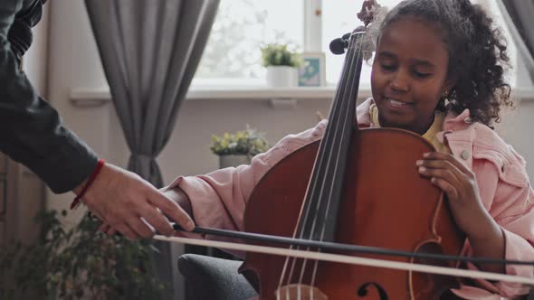 Helping Girl Play Double Bass