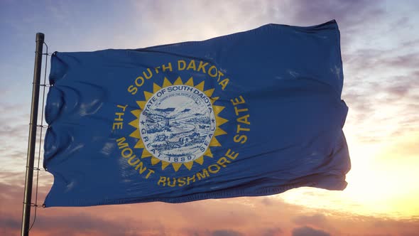 Flag of South Dakota Waving in the Wind Against Deep Beautiful Sky at Sunset