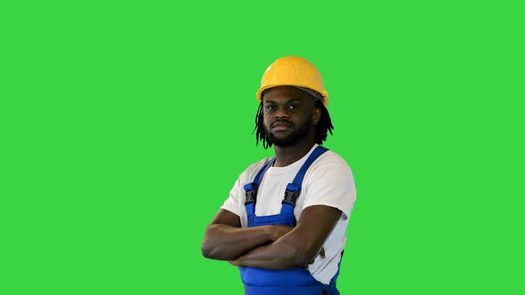 Young Handsome African American Worker Man Wearing Blue Uniform and Security Helmet Changing Poses