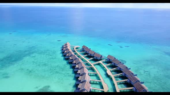 Aerial scenery of marine bay beach lifestyle by blue ocean with white sandy background of a dayout n