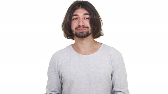 Confused Male Shrugging His Shoulders Isolated Over White Background