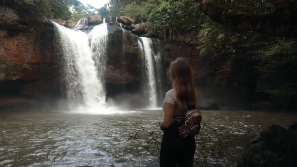 Back View of Female Tourist on Vacation Visit Waterfall in Thailandenjoy Nature