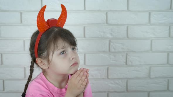Kid with demon horns. 