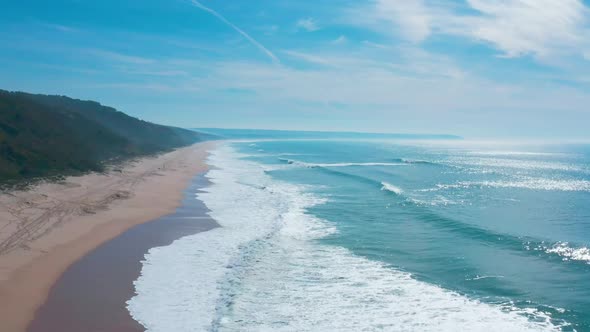 Flight Over the Sandy Beach and Waves