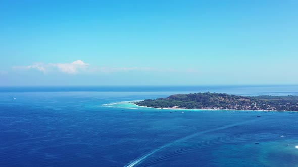 Aerial landscape of luxury seashore beach trip by turquoise water and bright sandy background of a d