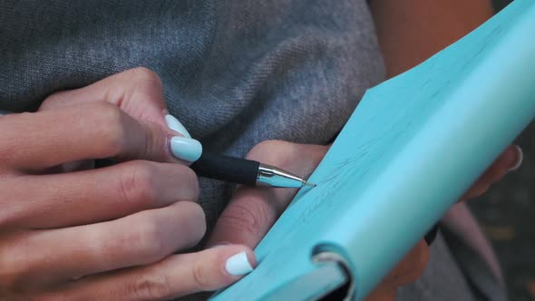 Girl Draws a Pen on Paper. Fashion Designer Drawing and Paint. Close-up