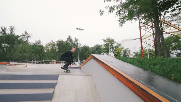 Skateboarder in Skate Park Doing Tricks Slow Motion