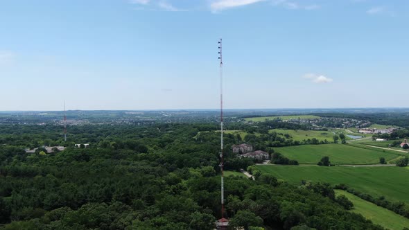 Aerial Forwarding Dolly Shot of Telephone and Communication Towers in Beautiful Blue Sky Background