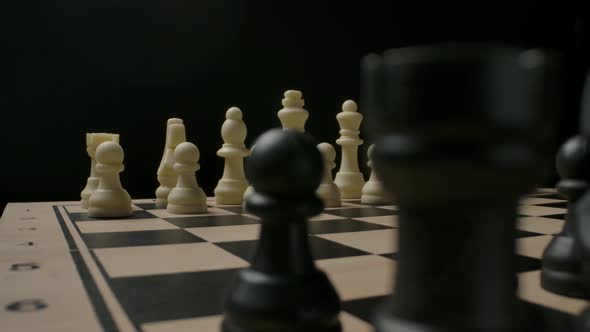 Confrontation Between Black and White Chess Pieces