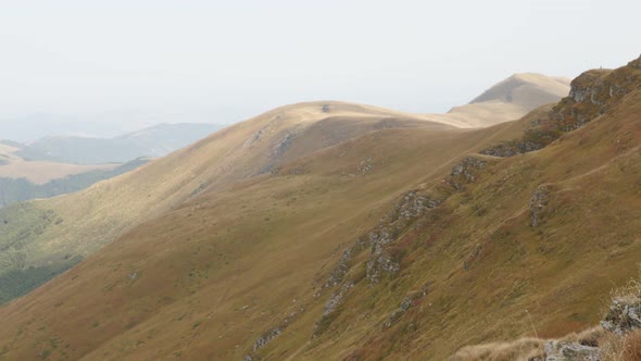 Highlands with clouds passing over  4K 2160p 30fps UltraHD footage - Tilting on Stara planina   moun